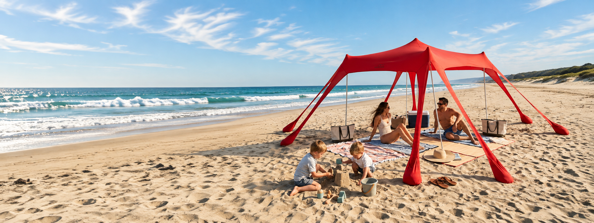 Red beach canopy beside the ocean