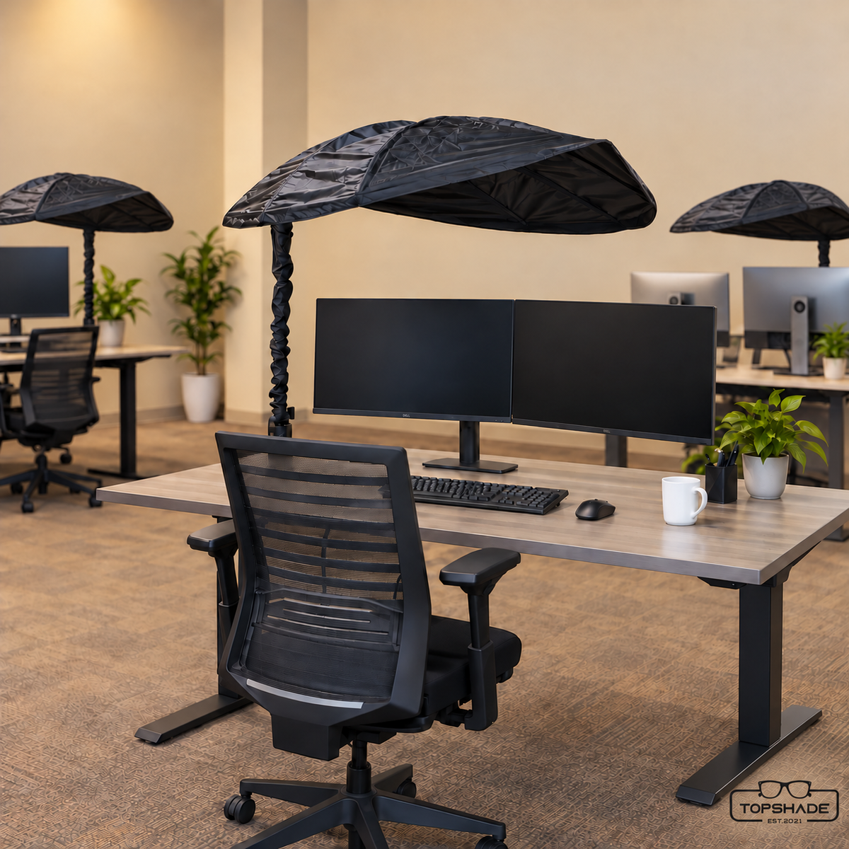 TopShade Cubicle and Desk Shade used at three office workstations